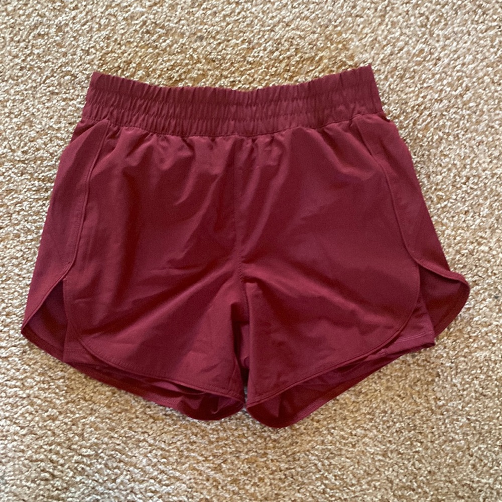 Burgundy/maroon red athletic shorts with built in spandex
